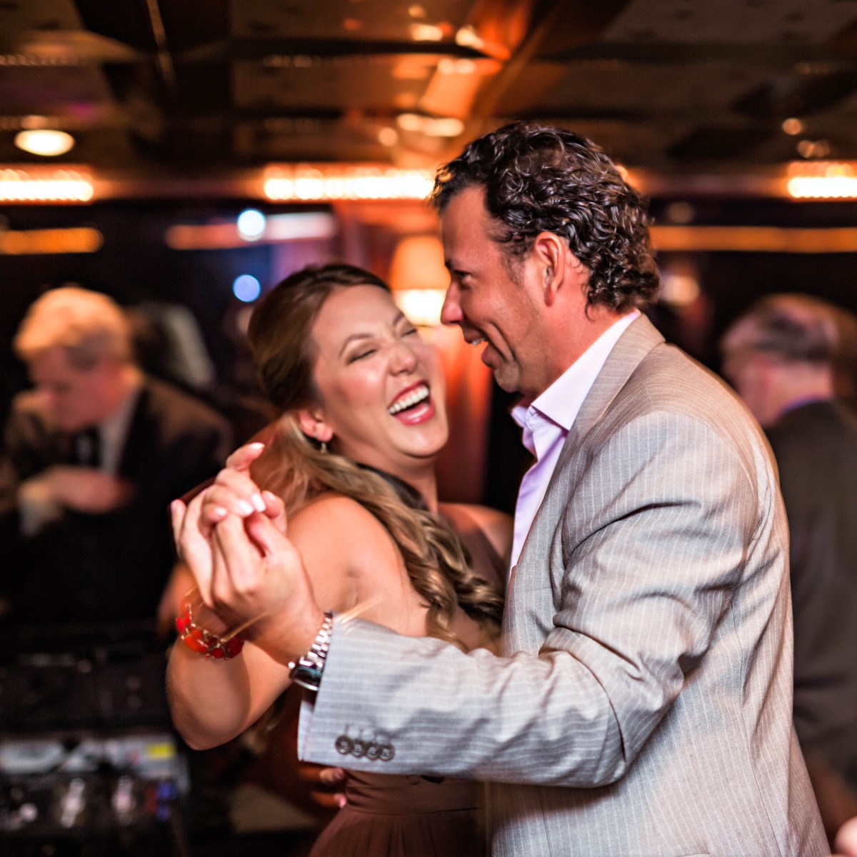 A couple dancing and laughing aboard a cruise ship in Knoxville, TN